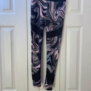 Justice Active Leggings Black w/peachy pink and gray swirls. Mesh insets Size 12